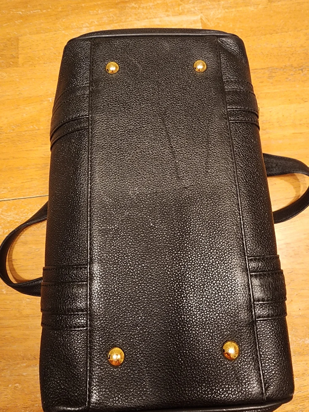 MCM Black Leather Boston Bag featuring polished gold-tone hardware